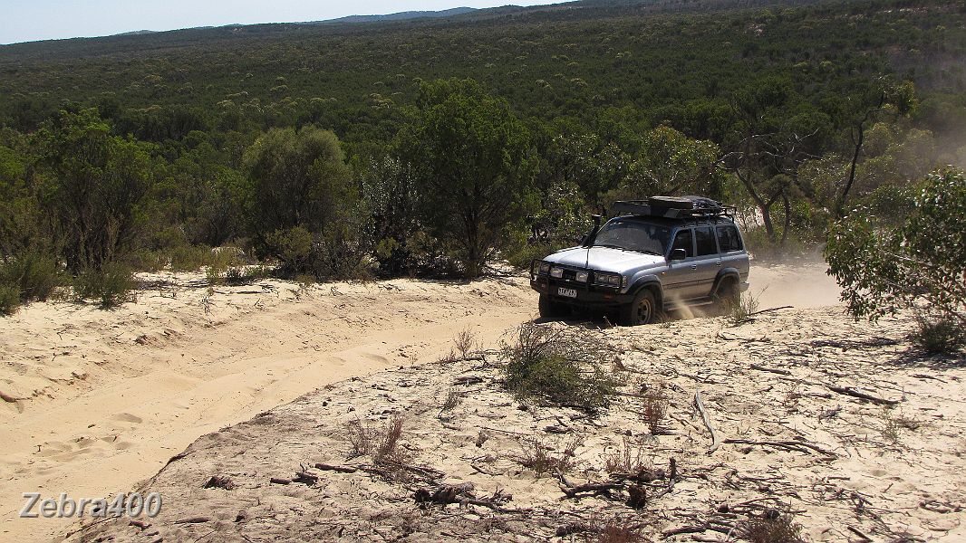 13-Frosty spins the wheels while negotiating a dune.jpg